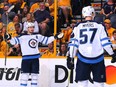 Winnipeg Jets forward Mark Scheifele (left) celebrates one of his goals against the Nashville Predators on April 27.