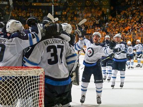 Winnipeg Jets players celebrate their second-round playoff series victory over the Nashville Predators on May 10.