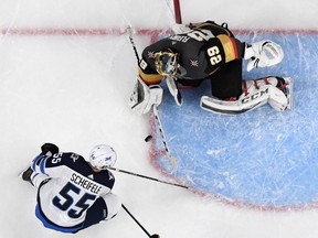 Winnipeg Jets forward Mark Scheifele tries to put a rebound past Vegas Golden Knights goalie Marc-Andre Fleury in Game 3 on May 16.