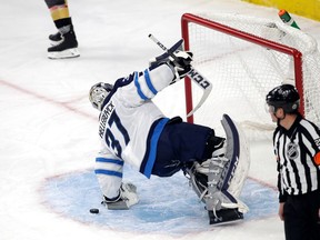 Winnipeg Jets goalie Connor Hellebuyck allows a goal in Game 3 against the Vegas Golden Knights on May 16.