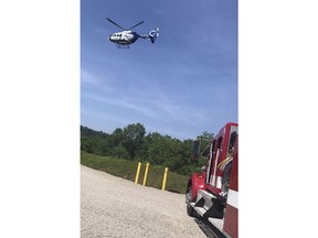 This photo provided by Smithburg Fire Department shows emergency personnel responding after oil tanks exploded in West Union, W.Va. on Friday, May 25, 2018.   State Department of Environmental Protection spokesman Jake Glance said workers were dismantling the tanks with some type of torch. Four people have been hospitalized.    (Smithburg Fire Department via AP)