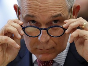 In this April 26, 2018 photo, Environmental Protection Agency Administrator Scott Pruitt removes his glasses as he testifies at a hearing of the House Appropriations subcommittee for the Interior, Environment, and Related Agencies, on Capitol Hil in Washington. The lobbyist whose wife rented a condo to Environmental Protection Agency head Scott Pruitt at $50 a night sought EPA committee posts for a lobbying client about the time Pruitt moved out, according to a newly released EPA memo.