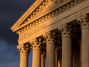 FILE - In this Oct. 10, 2017, file photo, the Supreme Court in Washington is seen at sunset. A flood of lawsuits over LGBT rights is making its way through the courts and will continue, no matter the outcome in the Supreme Court's highly anticipated decision in the case of a Colorado baker who would not create a wedding cake for a same-sex couple.