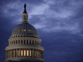 FILE - In this March 30, 2017, file photo, the Capitol Dome is seen at dawn in Washington. The Senate has kicked off its annual attempt to pass government funding bills. Success is hardly assured, but President Donald Trump has warned Congress that he will never sign another foot-tall, $1 trillion-plus government-wide spending bill, and he insists that he'll get full funding for his border wall.