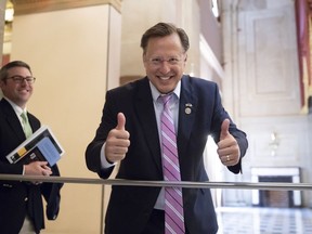 Rep. Dave Brat, R-Va., a member of the conservative House Freedom Caucus, smiles before the vote on the House farm bill which failed to pass, at the Capitol in Washington, Friday, May 18, 2018. The Freedom Caucus opposed the measure, seeking leverage to obtain a vote on a hard-line immigration plan. Last week's display of anarchy among House Republicans on immigration underscores how problematic and risky the issue is for a GOP that badly needs unity heading into November elections that will decide control of Congress.