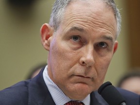 FILE - In this April 26, 2018 file photo, Environmental Protection Agency Administrator Scott Pruitt listen to questions as he testifies before the House Energy and Commerce subcommittee hearing on Capitol Hill in Washington.  Pruitt demanded and received unprecedented around-the-clock armed security protection on his very first day at the agency. EPA's internal watchdog disclosed new details on Monday about the pricey security arrangements taken to protect Pruitt in letters sent to two Democratic senators.