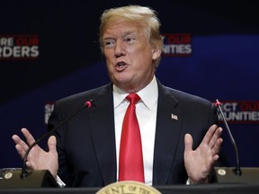 IN this May 23, 2018, photo, President Donald Trump speaks during a roundtable on immigration policy at Morrelly Homeland Security Center in Bethpage, N.Y. Trump has spent recent weeks publically hammering Congress to build his promised border wall and pass immigration legislating cracking down on "legal loopholes" he says allow criminals to enter the country illegally. But behind the scenes, Trump has shown little interest in jumping into an intensifying Capitol Hill debate over legislation that is unlikely to ever reach his desk.