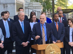 District of Columbia City Council President Phil Mendelson speaks during an impromptu news conference outside City Hall, Tuesday, May 1, 2018 in Washington, as other council members listen. The council has been roiled by mounting tensions and controversy that originally stemmed from councilman Trayon White claiming the Rothschilds, a Jewish banking dynasty and frequent subject of anti-Semitic conspiracy, were controlling Washington's weather conditions.