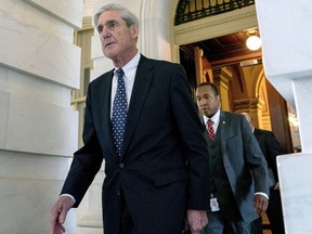 FILE - In this June 21, 2017, file photo, former FBI Director Robert Mueller, the special counsel probing Russian interference in the 2016 election, departs Capitol Hill following a closed door meeting in Washington. It was one year ago Thursday when Robert Mueller, the former FBI director, was appointed as special counsel to take over the Justice Department's investigation into possible coordination between Russia and Donald Trump's 2016 presidential campaign.