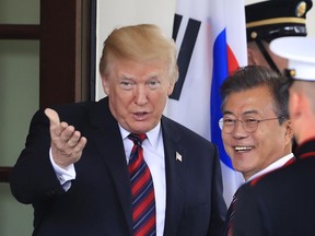 In this May 22, 2018, photo, President Donald Trump welcomes South Korean President Moon Jae-in to the White House in Washington. Ahead of a planned summit with North Korean leader Kim Jong Un, Trump's focus has been on stagecraft, the untiring will- they-won't-they drama, and prospects for a legacy-defining nuclear deal. The human rights woes of North Koreans have been more of an afterthought.