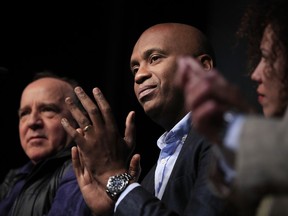 Havana-born artist Roberto Diago, center, and Cuban designer Celia Ledón, right, join other Cuban artists during a news conference at the Kennedy Center in Washington, Tuesday, May 8, 2018. Renewed tensions between the U.S. and Cuba did not stop the John F. Kennedy Center for the Performing Arts from shining a spotlight on the island's rich cultural heritage during what's being billed as the largest Cuban arts festival ever held in the United States.