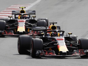 Australia driver Daniel Ricciardo, bottom, steers his Red Bull followed by his teammate Red Bull driver Max Verstappen, of the Netherlands, during the Azerbaijan Formula One Grand Prix, at the city circuit, in Baku, Azerbaijan, Sunday, April 29, 2018.