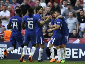 Chelsea's Eden Hazard, right, celebrates after scoring the opening goal during the English FA Cup final soccer match between Chelsea and Manchester United at Wembley stadium in London, Saturday, May 19, 2018.
