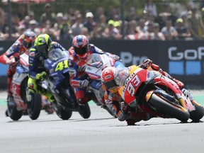 Moto GP rider Marc Marquez of Spain takes a curve during the French Motorcycle Grand Prix race in Le Mans, France, Sunday, May 20, 2018.