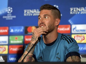 Real Madrid's Sergio Ramos gestures during a press conference at the Olympic stadium in Kiev, Ukraine, Friday, May 25, 2018 ahead of the Champions League final soccer match between Real Madrid and Liverpool on Saturday May 26. (UEFA Pool via AP)