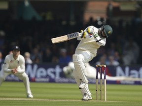 Pakistan's Mohammad Abbas avoids a ball bowled by England's Mark Wood during the third day of play of the first test cricket match between England and Pakistan at Lord's cricket ground in London, Saturday, May 26, 2018.