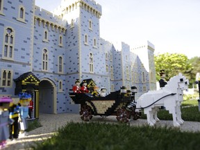 The newest attraction at Legoland in Windsor, England, Friday, May 11, 2018 shows a depiction of the upcoming wedding of Prince Harry and Meghan Markle outside Windsor Castle. All roads seem to lead to Windsor Castle, a magnificent fortress perched high on a hill topped by the royal standard when the queen is in residence. It is here -- a favoured royal playground since William the Conqueror built the first structure here in 1070 -- that the royal wedding of Prince Harry and Meghan Markle will take place.