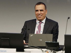 FILE -- In this file photo taken May 4, 2018, Tim CEO Amos Genish smiles prior to the start of the shareholders meeting, in Rozzano, near Milan, Italy. Telecom Italia's new board confirmed Amos Genish as CEO and named Fulvio Conti, a delegate of U.S. activist hedge fund Elliott, as chairman. The moves come after Elliott engineered a shareholder coup, wresting control of the board last week from controlling shareholder Vivendi.