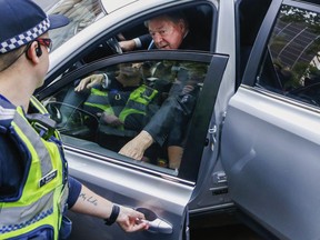 Cardinal George Pell, the most senior Catholic cleric to face sex charges, leaves court in Melbourne, Australia, Wednesday, May 2, 2018. Pell, the most senior Vatican official to be charged in the Catholic Church sex abuse crisis, arrived Wednesday for an appearance in the Melbourne court where he will eventually stand trial on sexual abuse charges spanning decades.