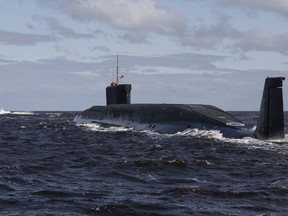 FILE - in this file photo taken on Thursday, July 2, 2009, the Russian nuclear submarine, Yuri Dolgoruky, is seen during sea trials near Arkhangelsk, Russia.  The Russian navy says one of its nuclear-powered submarines has successfully test-fired four intercontinental ballistic missiles in unison on Tuesday, May 22, 2018 from a submerged position in the White Sea.