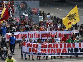 Protesters march towards the Presidential Palace to mark the anniversary of the siege by Islamic State group-aligned militants of Marawi city in southern Philippines, a year ago, Wednesday, May 23, 2018. The May 23 siege that troops crushed in October killed more than 1,100 mostly militants, left the mosque-studded city's heartland in rubbles, gave President Rodrigo Duterte's his most serious crisis and reinforced Asian fears that the Islamic State group has gained a foothold in the region.