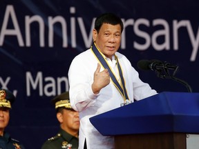 Philippine President Rodrigo Duterte addresses troops during the 120th anniversary of the Philippine Navy, Tuesday, May 22, 2018 in suburban Pasay city south of Manila, Philippines. Duterte has asked drug suspects in a central province to look for a reason to land in jail and stay there if they want to live longer in his latest brazen threat under his bloody anti-drug crackdown.