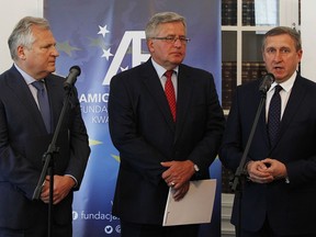 Former Polish presidents Aleksander Kwasniewski,left, and Bronislaw Komorowski,center, and the Ukrainian Ambassador to Poland Andrii Deshchytsia,right, speak to reporters about new strains in the Polish-Ukrainian relationship in Warsaw, Poland, Monday, May 28, 2018.The two Polish ex-presidents along with three former Ukrainian presidents issued a joint appeal for a return to Polish-Ukrainian unity amid strains in the relationship over historical issues at a time of rising nationalism in both countries.