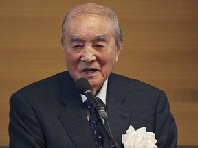 In this May 1, 2015 file photo, former Japanese Prime Minister Yasuhiro Nakasone delivers a speech during the annual meeting on Japan's constitution reform in Tokyo. One of Japan's most prominent former leaders, Nakasone has turned 100 years of age, fitting in a country known for longevity Nakasone, born on May 27, 1918, turns 100 on Sunday, May 27.