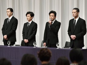 Members of Japan's pop group Tokio, from left, Tomoya Nagase, Taichi Kokubun, Shigeru Joshima and Masahiro Matsuoka attend a press conference on another member's sexual harassment in Tokyo Wednesday, May 2, 2018. Tatsuya Yamaguchi of the group, who acknowledged last week he had sexually harassed a teenage woman, tendered his resignation. Tokio leader Joshima said Yamaguchi apologized to the other members and submitted his resignation Monday night, but there was no immediate decision whether to accept it and the group won't disband.
