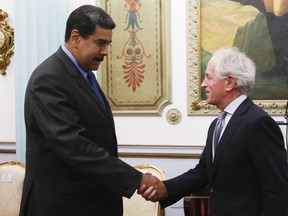 In this photo released by the Miraflores Presidential Press Office, Venezuela's President Nicolas Maduro, left, shakes hands with Republican Senator Bob Corker during a meeting at the Miraflores Presidential Palace in Caracas, Venezuela, Friday May 25, 2018. The Chairman of Senate Foreign Relations Committee met with Venezuelan President Nicolas Maduro two days after the embattled socialist leader kicked out the top U.S. diplomat in the country. There was no immediate comment from Republican Senator Bob Corker's office about the nature of the surprise visit. (Miraflores Presidential Press Office via AP)