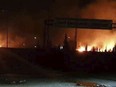 This photo released on Wednesday, May 9, 2018, by the Syrian official news agency SANA, shows flames rising after an attack in an area known to have numerous Syrian army military bases, in Kisweh, south of Damascus, Syria. Syrian state-run media said Israel struck a military outpost near the capital Damascus on Tuesday, saying its air defenses intercepted and destroyed two of the incoming missiles. The reported attack came shortly after U.S. President Donald Trump announced he was withdrawing from the Iran nuclear deal, calling Tehran a main exporter of terrorism in the region. (SANA via AP)