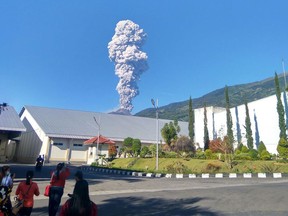 Mount Merapi spews volcanic materials from its crater as seen from Klaten, Central Java, Indonesia, Friday, May 11, 2018. Indonesia's most active volcano, Mount Merapi, has erupted, sending a column of volcanic materials as high as 5,500 meters (18,045 feet) into the sky.