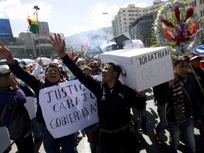 Students from El Alto Public University shout slogans against the government of President Evo Morales and carry a mock coffin representing Jonathan Quispe, a student who was killed in clashes, as they march through La Paz, Bolivia, Monday, May 28, 2018. The student died on May 24, in the midst of street protests led by university students demanding an increase in the budget for the public university of El Alto.