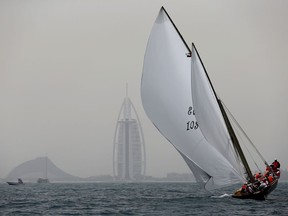 Ghazi, a 60-foot Dhow approaches the finish line to win the $2.7 million Al Gaffal traditional Dhow Race off the coast of Dubai, United Arab Emirates, after starting from the Gulf island of Sir Bu Nair about 100 kms (66 miles) west of Dubai, Monday, May 14, 2018.