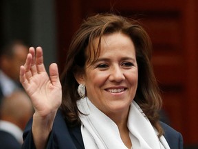 FILE - In this April 22, 2018 file photo, former first lady and independent presidential candidate Margarita Zavala waves to the press before the first of three debates among Mexico's presidential candidates in Mexico City. Zavala said on Wednesday, May 16 that she is dropping out of the country's July 1 presidential race.