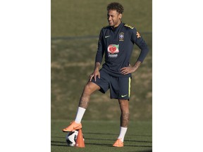 Brazil's Neymar smiles during a practice session of the Brazil national soccer team at the Granja Comary training center, in Teresopolis, Brazil, Tuesday, May 22, 2018.