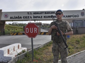 A Turkish soldier guards the entrance to the prison complex in Aliaga, Izmir province, western Turkey, where jailed US pastor Andrew Craig Brunson is appearing on his trial at a court inside the complex, Monday, May 7, 2018.  The 50-year-old evangelical pastor from Black Mountain, North Carolina, faces up 35-years in prison in Turkey, on charges that he aided terror groups and engaged in espionage. The pastor of the Izmir Resurrection Church denies any wrongdoing.