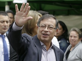 Gustavo Petro, presidential candidate for Colombia Humana, waves before voting in the presidential election in Bogota, Colombia, Sunday, May 27, 2018.