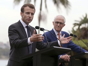French President Emmanuel Macron, left, speaks as Australian Prime Minister Malcolm Turnbull listens during a joint press conference in Sydney, Wednesday, May 2, 2018. Macron is on a three-day visit to Australia.