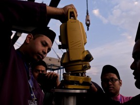 Members of the Malaysian Islamic authority prepare for the process of "Rukyah Hilal Ramadan," the sighting of the new moon to determine the start of the holy fasting month of Ramadan in Kuala Lumpur, Malaysia, Tuesday, May 15, 2018. Muslims around the world will start observing Ramadan, the holiest month in Islamic calendar this week.