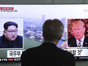 A man watches a TV screen showing file footage of U.S. President Donald Trump, right, and North Korean leader Kim Jong Un during a news program at the Seoul Railway Station in Seoul, South Korea, Wednesday, May 16, 2018. North Korea's breaking off a high-level meeting with South Korea and threatening to scrap next month's historic summit with President Trump over allied military drills is seen as a move by Kim to gain leverage and establish that he's entering the crucial nuclear negotiations from a position of strength. Washington and Seoul, which have no intentions to overpay for whatever Kim brings to the table, say international sanctions forced Kim into talks after a flurry of weapons tests.