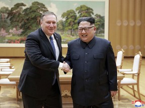 FILE - In this May 9, 2018, file photo provided by the North Korean government, U.S. Secretary of State Mike Pompeo, left, shakes hands with North Korean leader Kim Jong Un during a meeting at Workers' Party of Korea headquarters in Pyongyang, North Korea. Korean language watermark on image as provided by source reads: "KCNA" which is the abbreviation for Korean Central News Agency. (Korean Central News Agency/Korea News Service via AP, File)