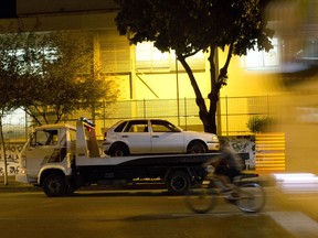 A car similar to the one where councilwoman Marielle Franco and her driver Anderson Pedro Gomes were killed, is seen on a flat bed before the reconstruction of the crime scene at the site where they were killed, in Rio de Janeiro, Brazil, Thursday, May 10, 2018. Authorities will re-enact the murder of councilwoman Marielle Franco, a black city councilwoman shot in the head four times. Franco was slain two months ago while returning from an event focused on empowering young black women.