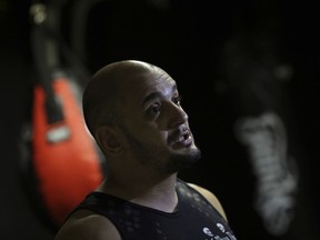 In this May 8, 2018 photo, martial arts teacher Daniel Bastos, speaks during an interview with the AP at a gym, in the Boa Viagem neighborhood of Recife, Pernambuco state, Brazil. "Lula's mask has fallen. He is a saboteur," said Bastos when talking about former president Luis Inacio Lula da Silva.