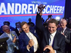 Andrew Scheer, right, is congratulated by Maxime Bernier after being elected the new leader of the federal Conservative party at the federal Conservative leadership convention in Toronto on Saturday, May 27, 2017.