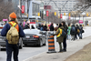 Striking York University employees stop traffic to explain what their strike is about in March 2018.