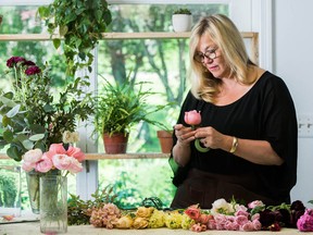Holly Heider Chapple lays out and inspects each flower that goes into a bridal bouquet.
