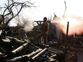 In this March 30, 2017 file photo, a Ukrainian serviceman shoots a grenade launcher during fighting with pro-Russian separatists in Avdiivka, Donetsk region.
