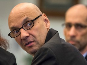 In this March 21, 2018 photo,  Andrew Urdiales  looks back into the courtroom gallery as opening statements began his trial in Santa Ana, Calif.