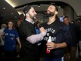 In this Oct. 14, 2015 file photo, general manager Alex Anthopoulos and outfielder Jose Bautista celebrate the Toronto Blue Jays' ALDS series victory over the Texas Rangers.